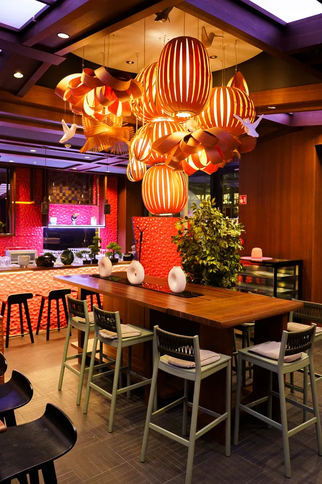Inside Mama's & Papa's: long tables under big glowing lanterns
